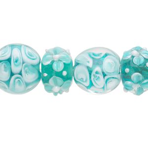 Bead, lampworked glass, clear / white / aqua, 13mm-18x10mm bumpy rondelle with flower design and 13-18mm puffed flat round with flower design. Sold per pkg of 16.