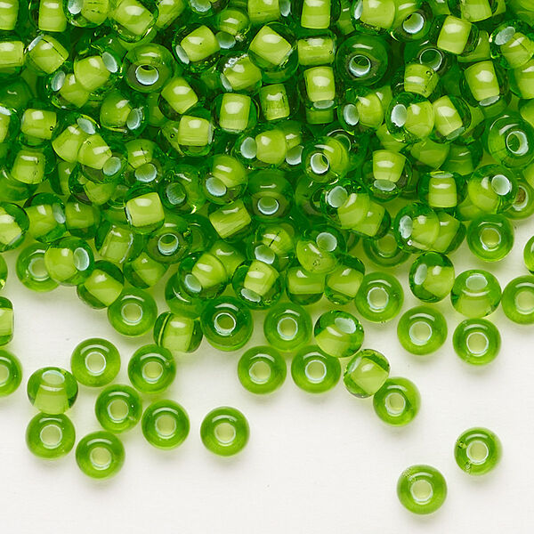Seed bead, Preciosa Ornela, glass, transparent chalkwhite-lined green, #6 rocaille. Sold per 50-gram pkg. image number 0