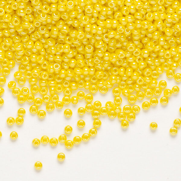 Seed bead, Preciosa Ornela, glass, opaque luster yellow, #11 rocaille. Sold per 500-gram pkg. image number 0