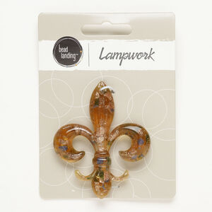 Focal, lampworked glass, opaque and translucent tan/ blue / green, 60x49mm fleur-de-lis with copper-colored glitter. Sold individually.