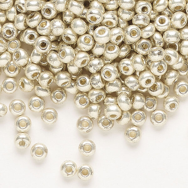Seed bead, Preciosa Ornela Czech glass, pkg/50g, #6 rocaille, opaque silver finish metallic clear, (18303). image number 0