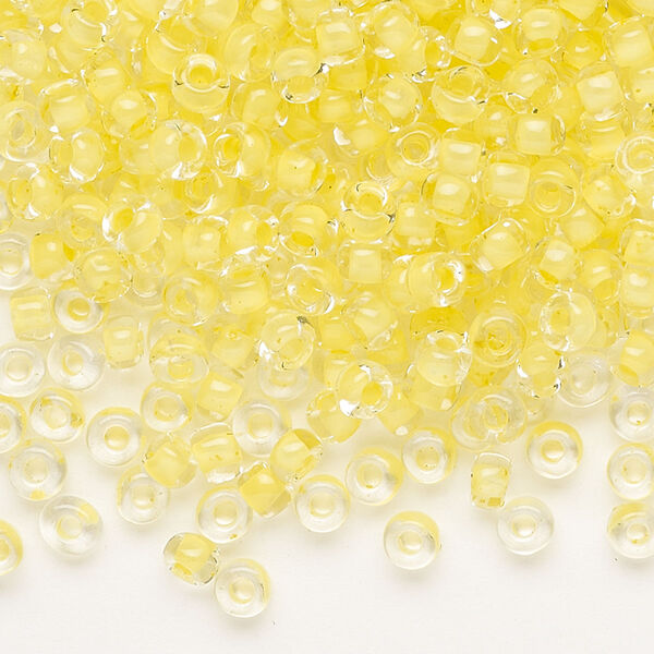 Seed bead, Dyna-Mites™, glass, translucent inside color light yellow, #6 round. Sold per 40-gram pkg. image number 0