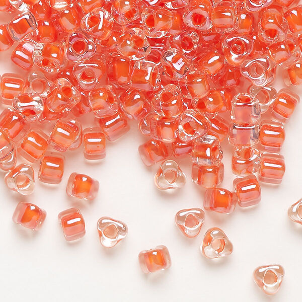 Seed bead, Miyuki, glass, transparent clear color-lined coral, (TR1111L), #5 triangle. Sold per 250-gram pkg. image number 0