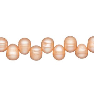 Pearl, cultured freshwater (dyed), daylily, 7x6mm-10x7mm top-drilled rice, D grade, Mohs hardness 2-1/2 to 4. Sold per 15-inch strand.