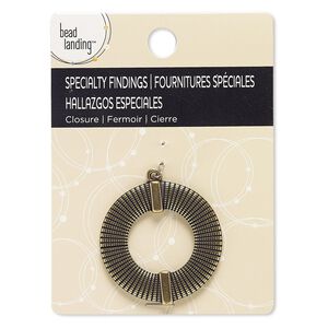 Focal, antiqued brass-finished "pewter" (zinc-based alloy), 39mm textured open round. Sold individually.