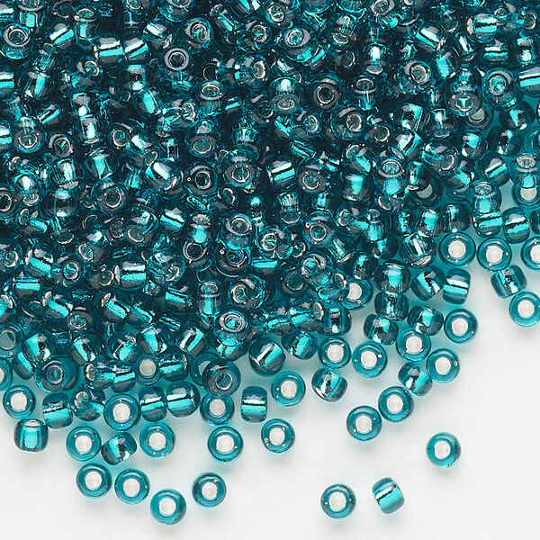 Seed bead, Dyna-Mites™, glass, silver-lined translucent teal blue, #8 round. Sold per 40-gram pkg. image number 0
