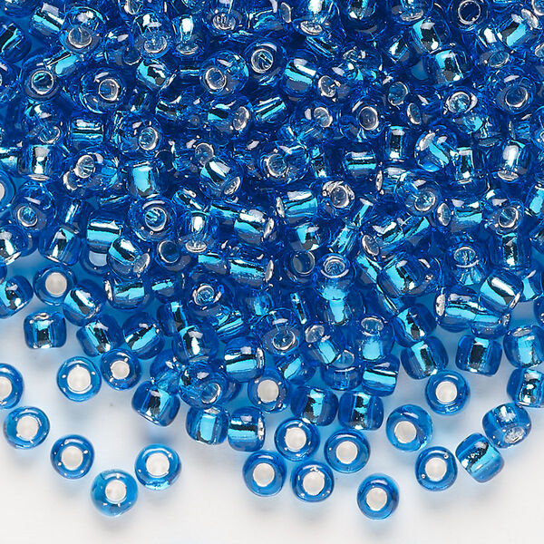 Seed bead, Dyna-Mites™, glass, transparent silver-lined turquoise blue, #6 round. Sold per 40-gram pkg. image number 0
