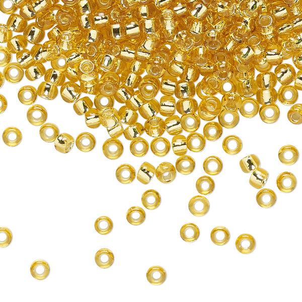 Seed bead, TOHO BEADS®, glass, pkg/250g, #8 round, transparent silver-lined light topaz (TR-08-22). image number 0