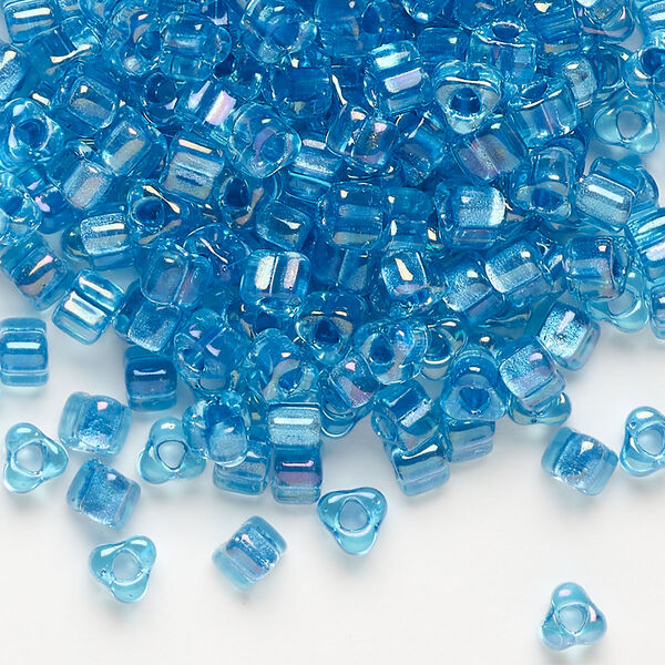 Seed bead, Miyuki, glass, transparent light blue color-lined aqua, (TR1823), #5 triangle. Sold per 250-gram pkg. image number 0