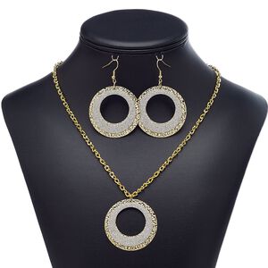 Necklace and earring set, glitter paper and gold-finished steel, silver, 42mm round go-go, 20-inch necklace with 1-1/2 inch extender chain and self-closing hook clasp, 2-1/2 inch earrings with fishhook ear wire. Sold per set.