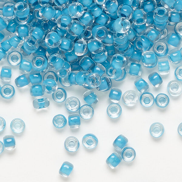 Seed bead, Dyna-Mites™, glass, translucent inside color turquoise blue, #6 round. Sold per 40-gram pkg. image number 0