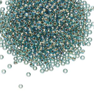 Seed bead, TOHO BEADS®, glass, pkg/250g, #11 round, translucent gold-lined rainbow aqua (TR-11-995).