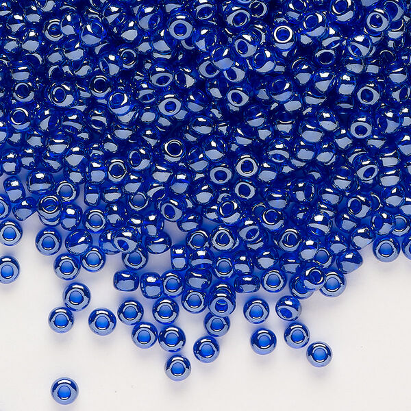 Seed bead, glass, pkg/50g, #8 rocaille, transparent luster cobalt blue. image number 0