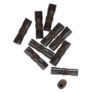 Bead, bone (dyed), black, 14x4mm-13x3mm tube. Sold per pkg of 10.