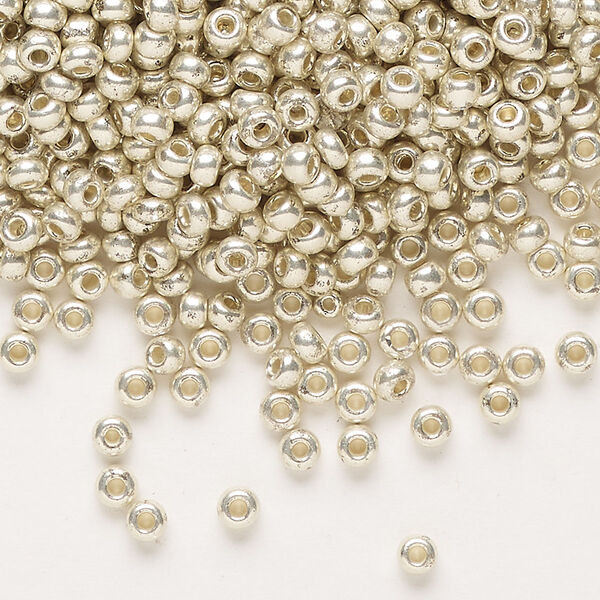 Seed bead, Preciosa Ornela Czech glass, pkg/500g, #8 rocaille, opaque silver finish metallic clear, (18303). image number 0
