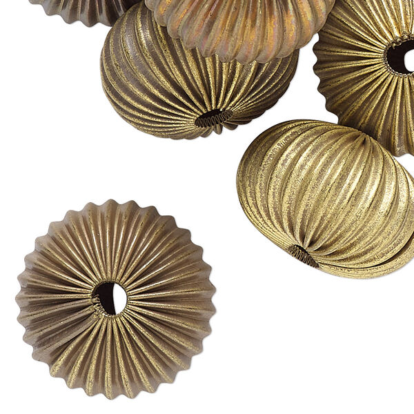 Bead, raw brass, 21x13mm- 22x14mm corrugated rondelle with 3.5mm hole. Sold per pkg of 24. image number 0