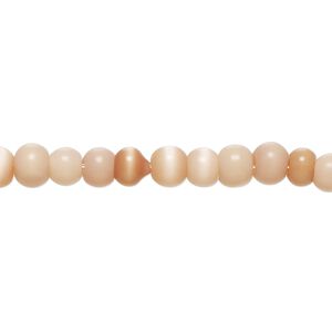 Bead, cat's eye glass (fiber optic glass), light to dark peach, 4-6mm irregular round. Sold per 14-inch strand, approximately 90 beads.