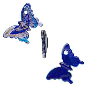 Focal, lampworked glass, blue / light blue / black with silver-colored foil and copper-colored glitter, 56x54mm butterfly. Sold individually.