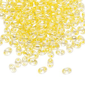 Seed bead, Preciosa Twin™ Czech glass, pkg/250g, 5x2.5mm oval, transparent yellow terra color-lined clear, (38686).
