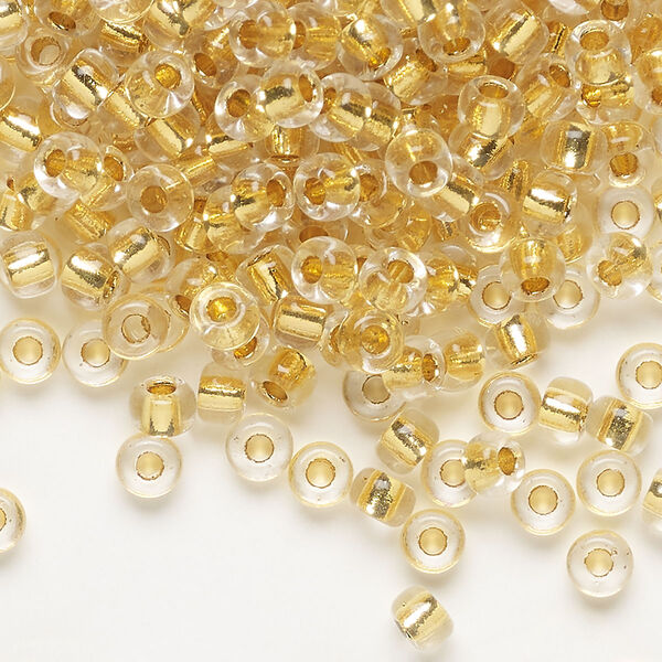 Seed bead, Miyuki, glass, pkg/4g, #6 rocaille, translucent 24Kt gold-lined crystal gold, (RR-195). image number 0
