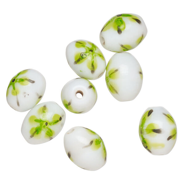 Bead, lampworked glass, opaque white / black / green, 14x11mm-13x10mm oval with painted flower design. Sold per pkg of 8. image number 0